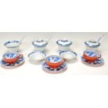 A collection of Chinese ceramics to include blue and white lidded tea cups with matching saucers