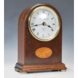 A 20th Century contemporary mahogany inlaid cased mantel clock by Knight & Gibbons, the clock of