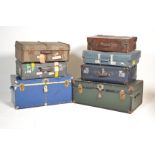 A collection / stack of vintage and early 20th century trunks and suitcases. To include steamer