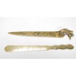 A vintage 20th Century decorative Chinese brass letter opener having finely engraved floral and bird