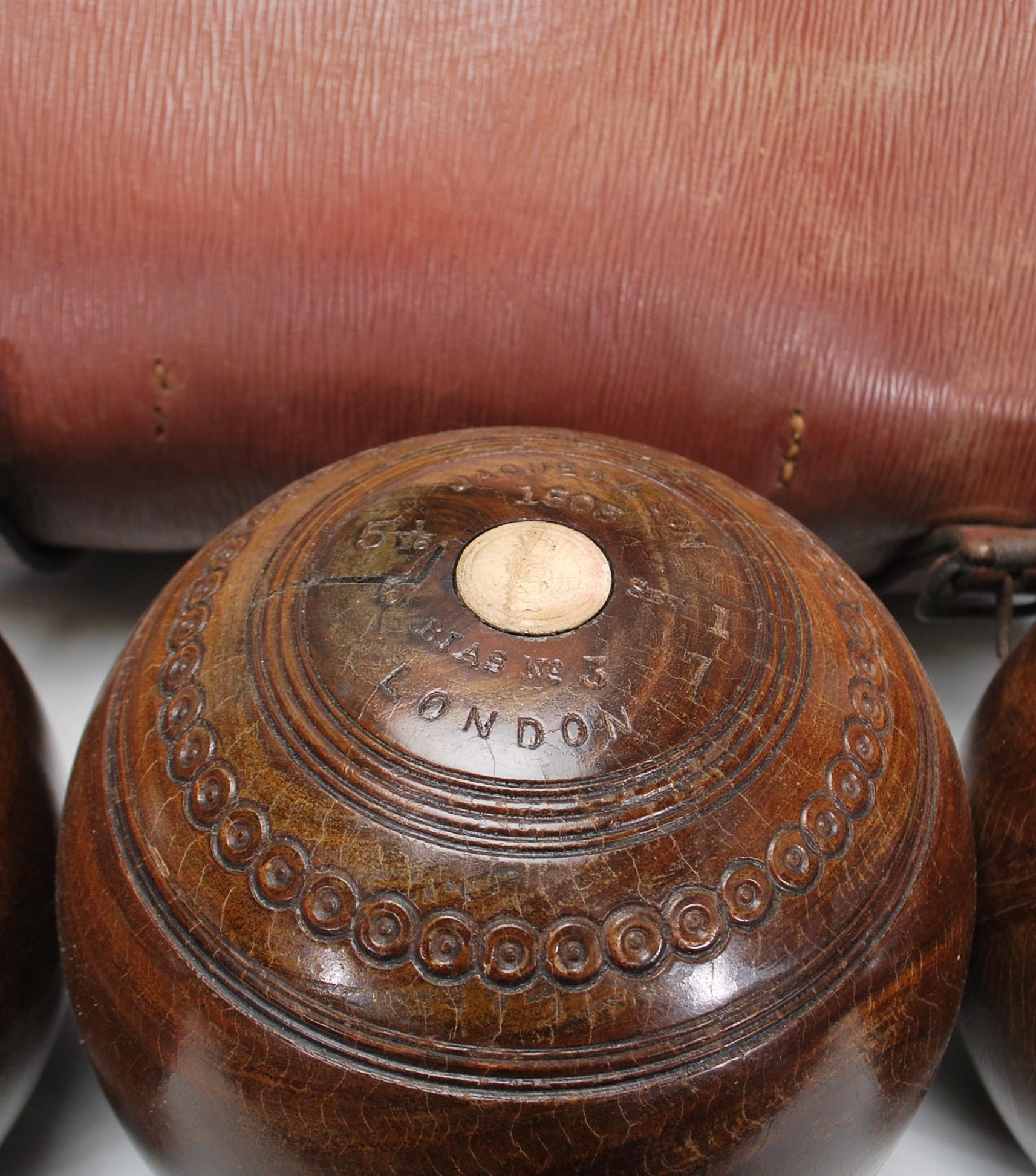 Crown Green Bowls - A set of three early 20th century vintage lignum vitae bowling bowls, in - Image 5 of 6