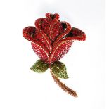 A Butler and Wilson fashion jewellery brooch in the form of a rose set with Swarovski crystals.