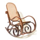 A vintage 20th century Thonet style bentwood rocker / rocking chair with rattan weave seat and