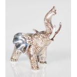 A silver figurine of an elephant with an extended trunk trumpeting in the air. Weight 27g.