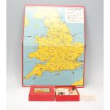 A vintage 1930's Touring England board game complete with four counters, dice, cards, instructions