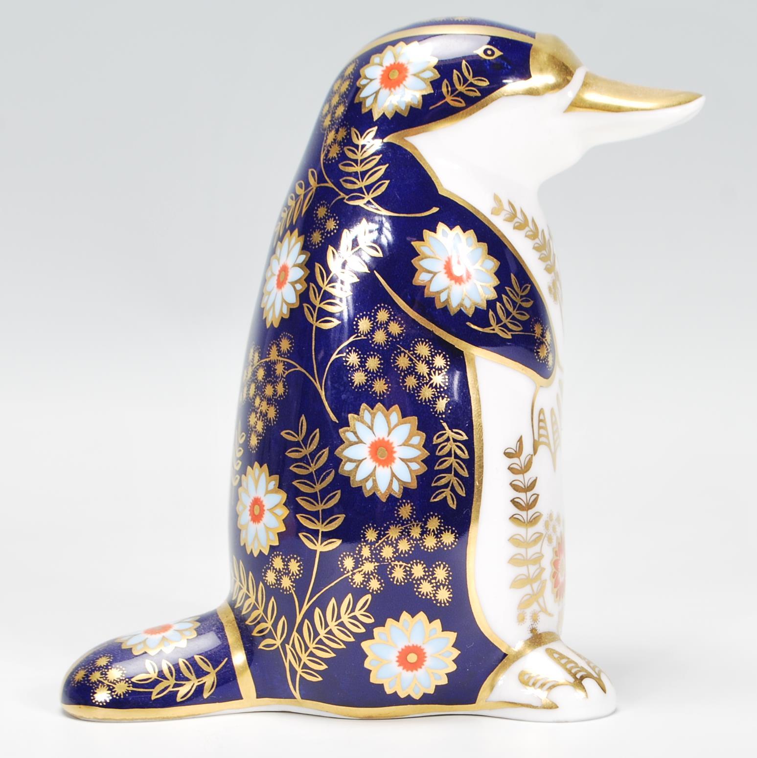 A Royal Crown Derby porcelain figurine of a Platypus in poly-chrome colourways, stamped to the - Image 2 of 6