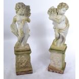 A pair of good 20th Century reconstituted well weathered stone garden ornament of a cherubs /
