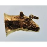 A gold plated wax seal in the form of a horses head with a crest to the base having pendant bale