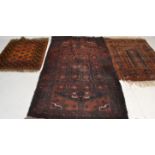 A  collection of Persian / Islamic rugs to include a red ground Bokhara rug with multiple medallions