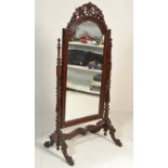 An impressive large antique style mahogany cheval mirror.  Raised on hairy paw feet with scroll