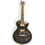A vintage 20th Luxor Deluxe vintage electric 6 string rhythm guitar in black colourway with mother