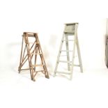 A good early 20th century a-frame trestle edges wooden ladder. Together with another painted