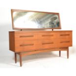 A retro 20th Century teak wood dressing table chest, full length mirror over a configuration of