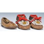 A pair of 20th Century Native American Indian beadwork shoes having leather soles with stunning