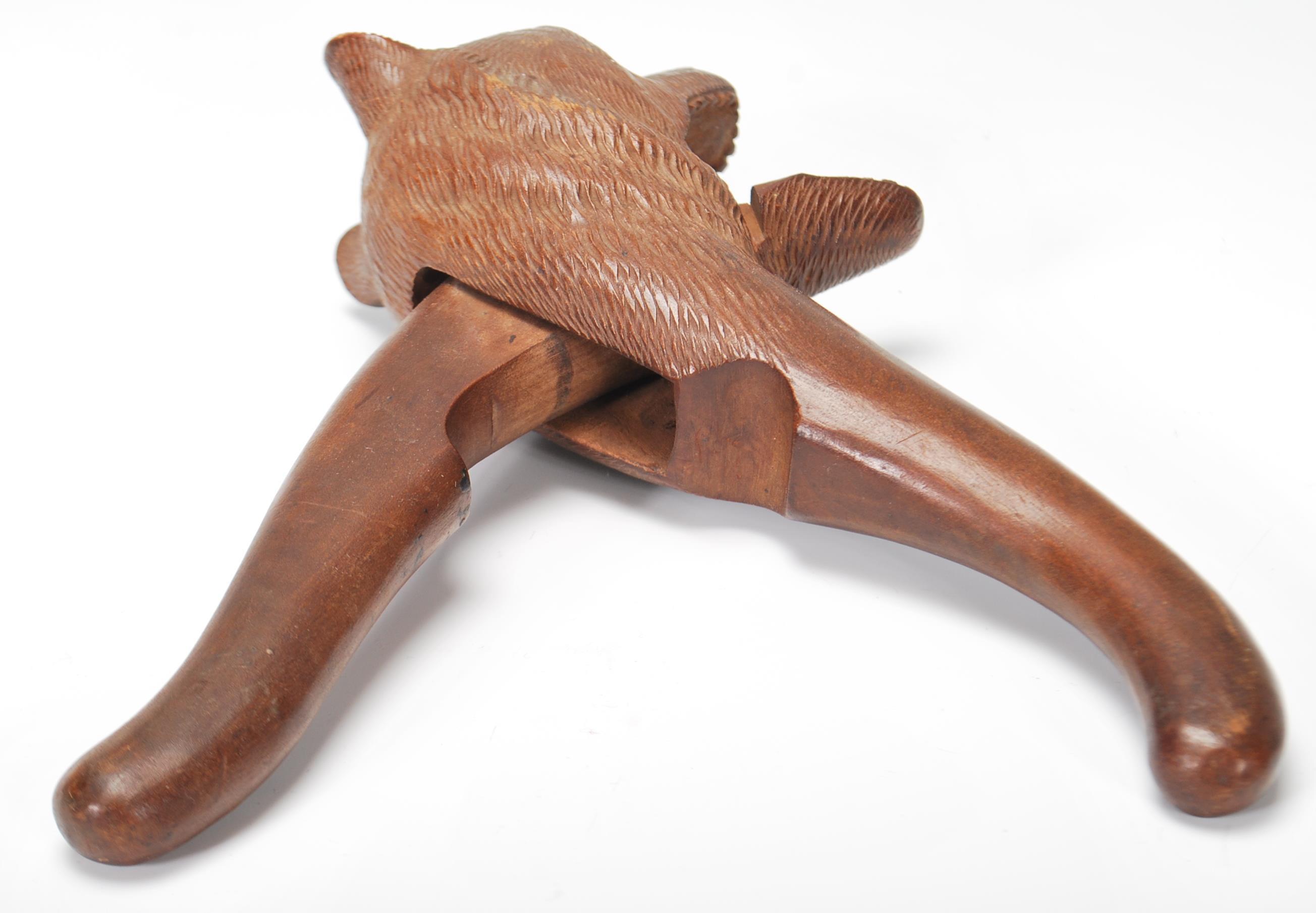 An early 20th Century black forest wooden nut cracker in the form of a bear having carved - Image 4 of 6