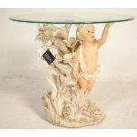 A vintage 20th Century Italian Academy collection side table in the form of a Cherub surrounded with