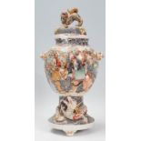 A Japanese 19th / early 20th century Satsuma vase decorated with warriors and people. The foot of