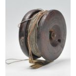 A 19th Century antique mahogany starback fishing reel having a copper mount with brass fittings.