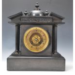 A 19th century French black slate mantel clock of architectural form, the circular dial with Roman