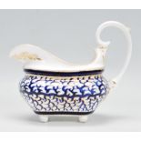A 19th Century Crown Derby porcelain sauce boat / cream jug having hand painted cobalt wave