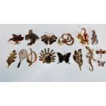 A selection of vintage 20th Century fashion jewellery brooches many being enamelled to include a