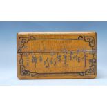A 19th Century Chinese wooden charge box having carved character marks throughout with black painted