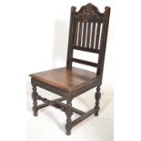 A Victorian 19th century carved solid oak hall chair having a green man carved mask top rail over