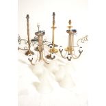 A group of contemporary antique style brass light fittings and lamps to include a pair of drop