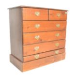 A 20th Century antique manner pine chest of drawers on stand having a configuration of two short