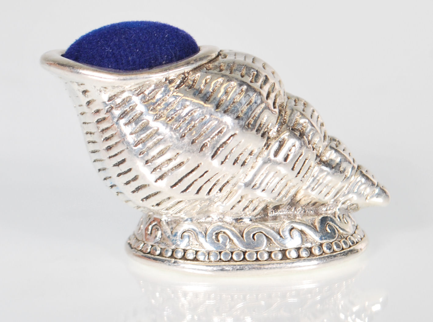 A stamped 925 silver pin cushion in the form of a conch shell raised on a footed base with a blue - Image 3 of 7