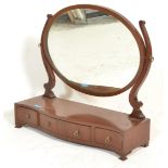 A 19th Century mahogany swing / toilet mirror having a serpentine-shaped box base fitted with