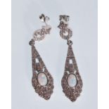 A pair of stamped 925 silver Art Deco drop earrings set with oval opal panels and white stones.