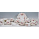 A Royal Crown Derby porcelain part tea service in the ' Derby Posies ' pattern. Comprising cups,