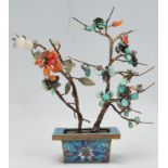 A 19th Century Chinese bonsai tree ornament having turquoise and red stone leaves and flowers, set