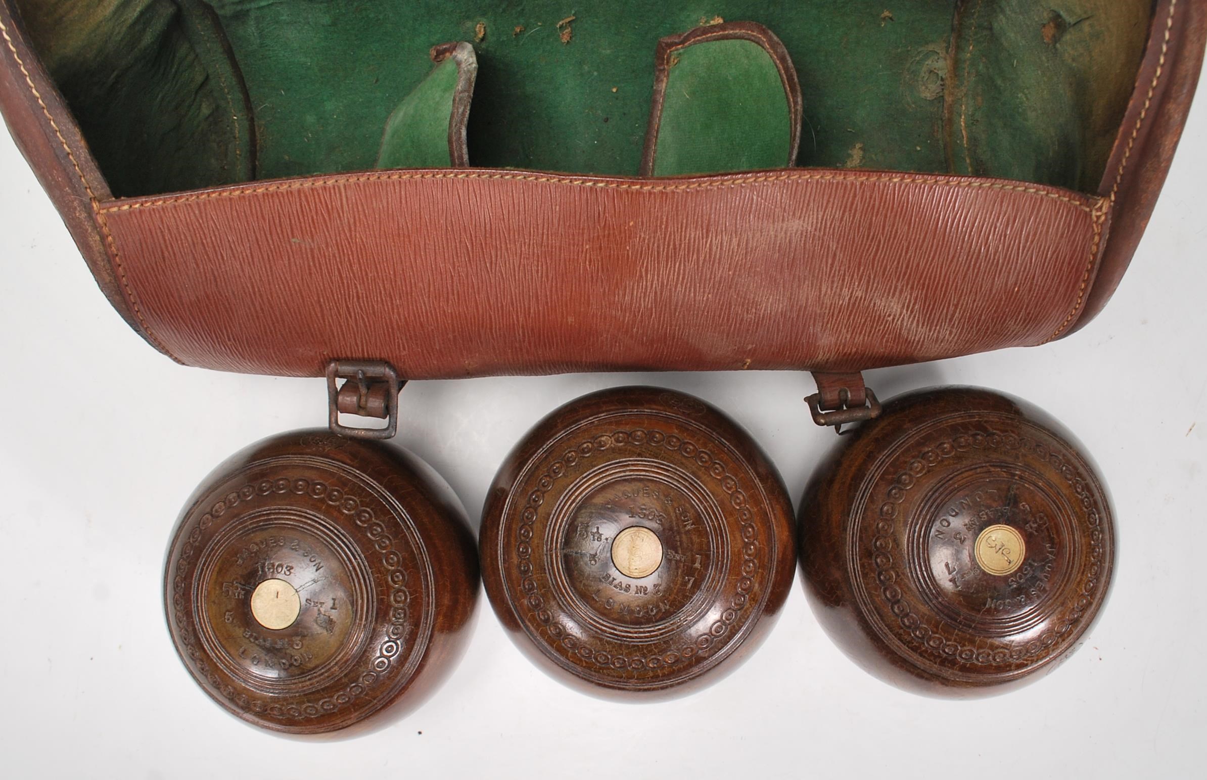 Crown Green Bowls - A set of three early 20th century vintage lignum vitae bowling bowls, in - Image 3 of 6