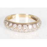 A hallmarked 14ct gold ladies ring set with two rows of round cut diamonique round stones.