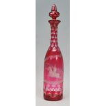 A late 19th / early 20th Century etched cranberry glass decanter, the decanter etched with a soldier