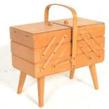 A retro 20th Century cantilever work box / sewing box, carry handle to the top opening to reveal