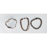 A group of three 925 silver bracelets to include a floral panel bracelet, a multi thread twist