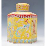 A Chinese 20th century hexagonal famille juane ginger jar and lid. The yellow ground with scenes