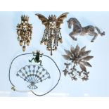 A collection of Butler and Wilson fashion jewellery brooches set with Swarovski crystals to