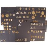 COLLECTION OF ASSORTED MILITARY UNIFORM CAP BADGES