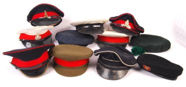 COLLECTION OF ASSORTED MILITARY PEAKED CAPS / BERE