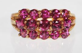 A 9ct gold (stamped 9k) Rhodolite garnet three row