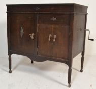 An early 20th century oak cased gramophone cabinet