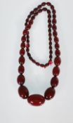 An early 20th Century cherry bakelite necklace con