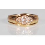 A hallmarked 9ct gold and CZ band ring. The ring h