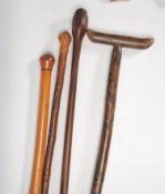A group of four 20th Century walking sticks to inc
