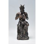 A cast faux bronze classical figurine sculptural o