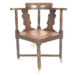 A 19th Century Victorian carved oak corner chair,